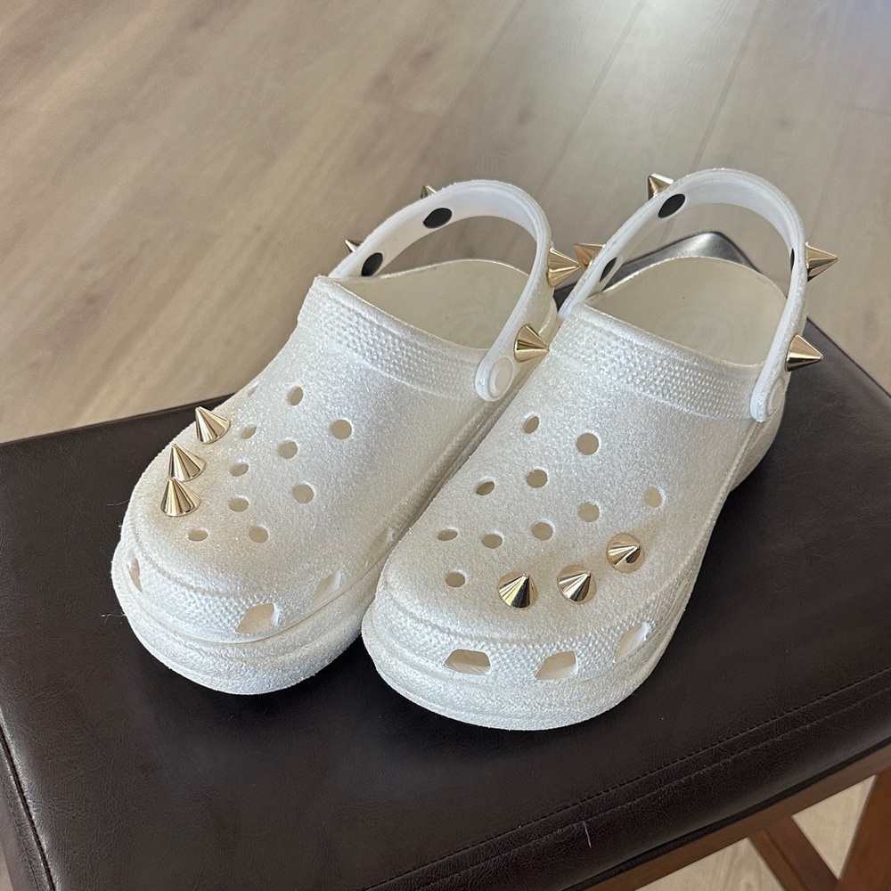 CROCS Classic Bae in metallic white Clogs with gold studs. Like new. Size 6.